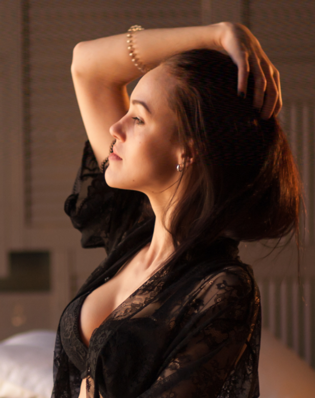Side profile of a woman in lingerie