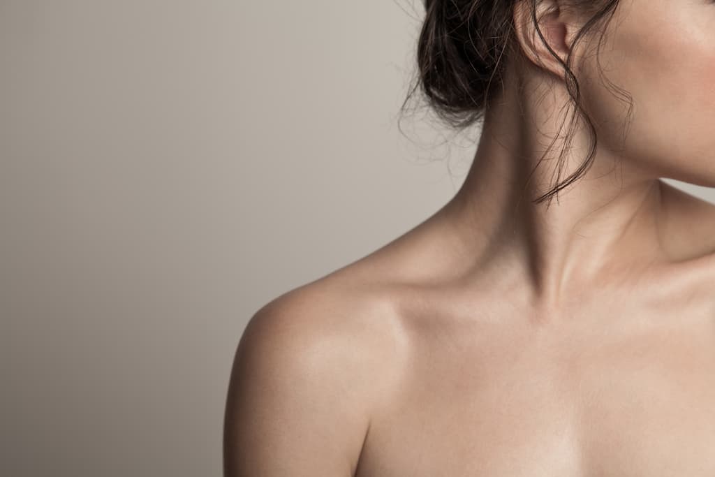 Woman's neck and shoulder area showing smooth, tightened skin results that demonstrate the natural-looking firmness achievable with Renuvion skin tightening treatment